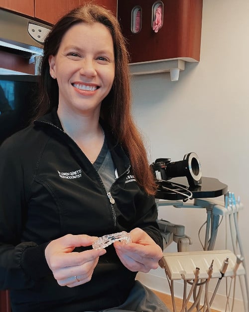 Dr. Loren Genetti with oral appliance for Sleep Apnea treatment